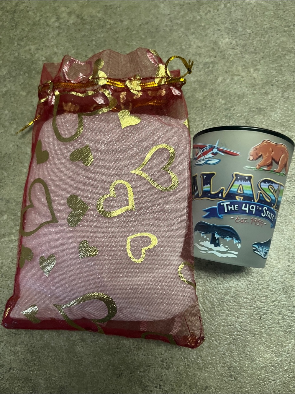 New Alaska shot glass in red and gold organza bag